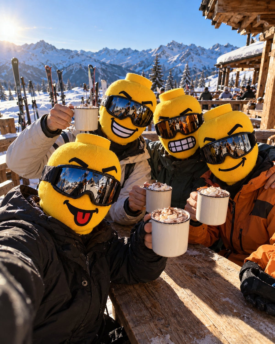 Four friends at apres-ski with hot chocolate, each in a different Blockhead face